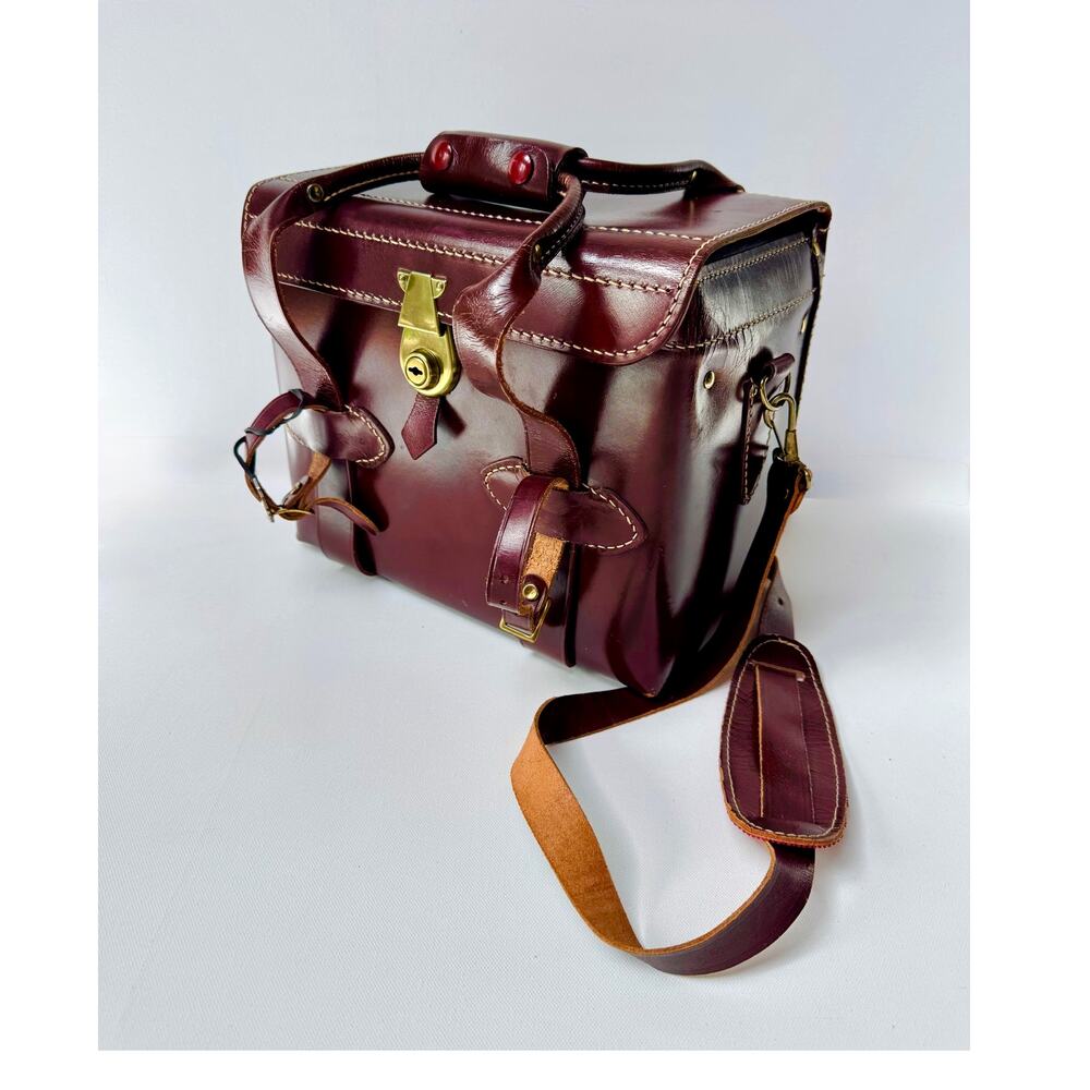 Vintage Burgundy Leather Travel Bag with Key and Shoulder Strap